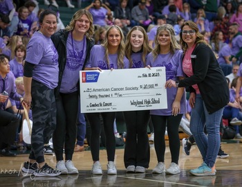 6 girls with check for American Cancer Society