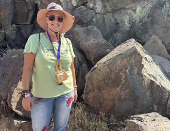 Ms. Foster standing in front of rocks