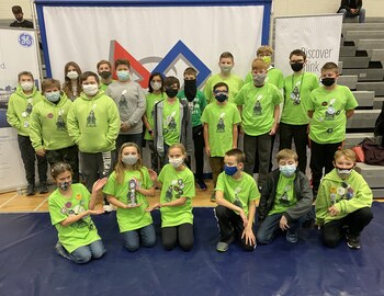Middle School Robotics Team with Trophy