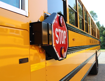 Side of new bus, including stop sign