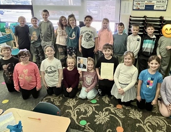 Mrs. Nykerk's class with the letter and a signed photo of President Biden