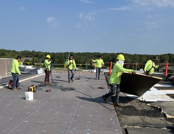 6 crew members working on roof