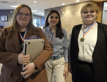 Three members of the team with medals