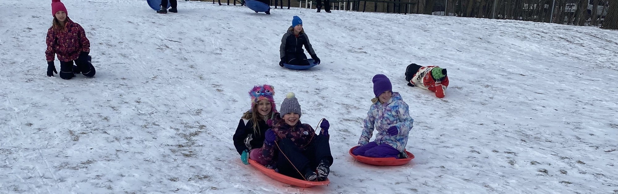 Students sledding at Dorr Elementary