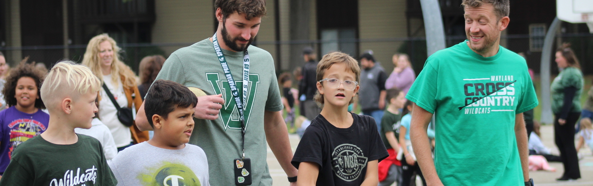 Three students walking with two teachers during Steeby's Walk-a-Thon