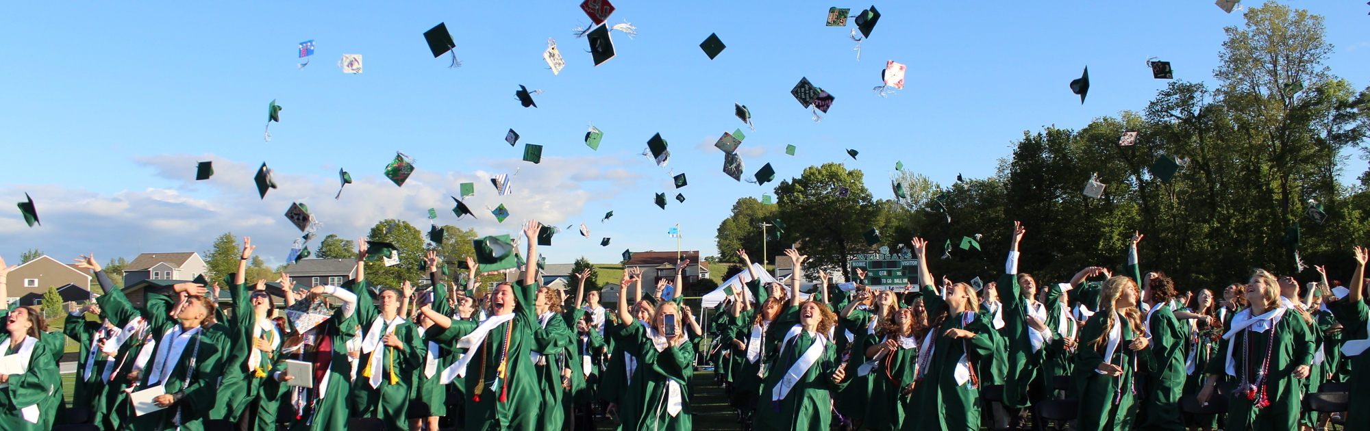 Seniors throwing graduation caps