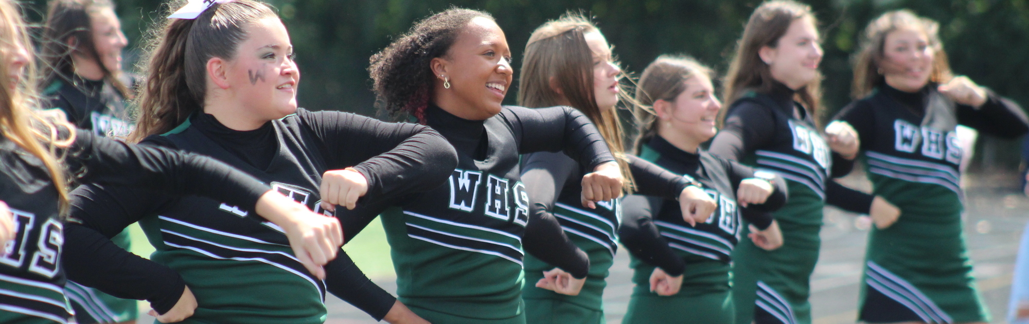 Varsity cheerleaders leading a cheer