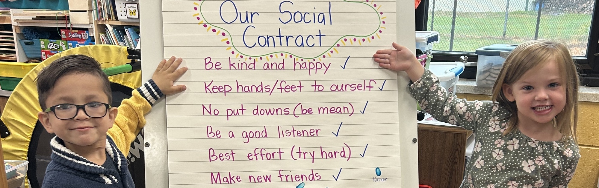 Elementary students showing their social contract