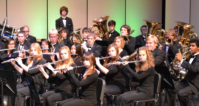 photo of band students performing on stage.