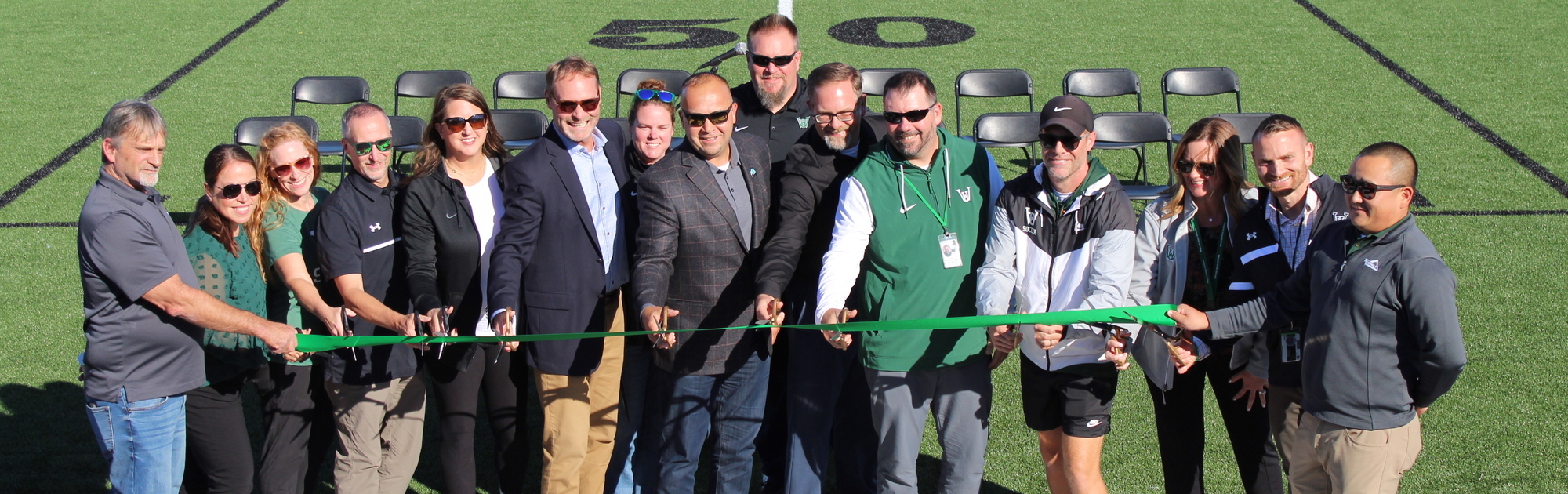 Cutting the ribbon for the soccer field